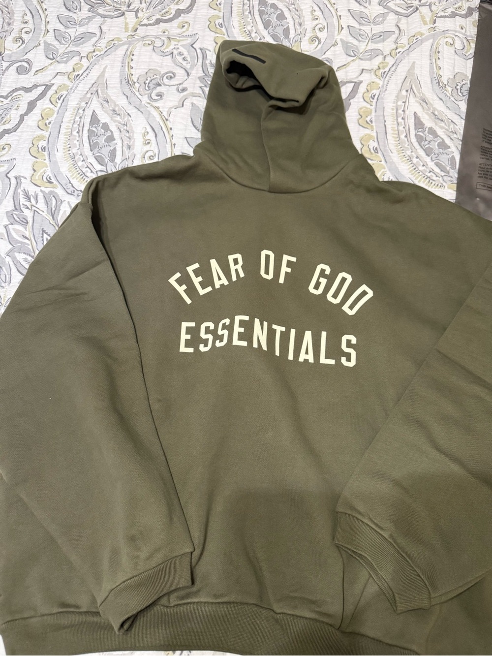 Fear of God Essentials Hoodie in military green.